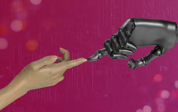 two hands touching each other in front of a pink background